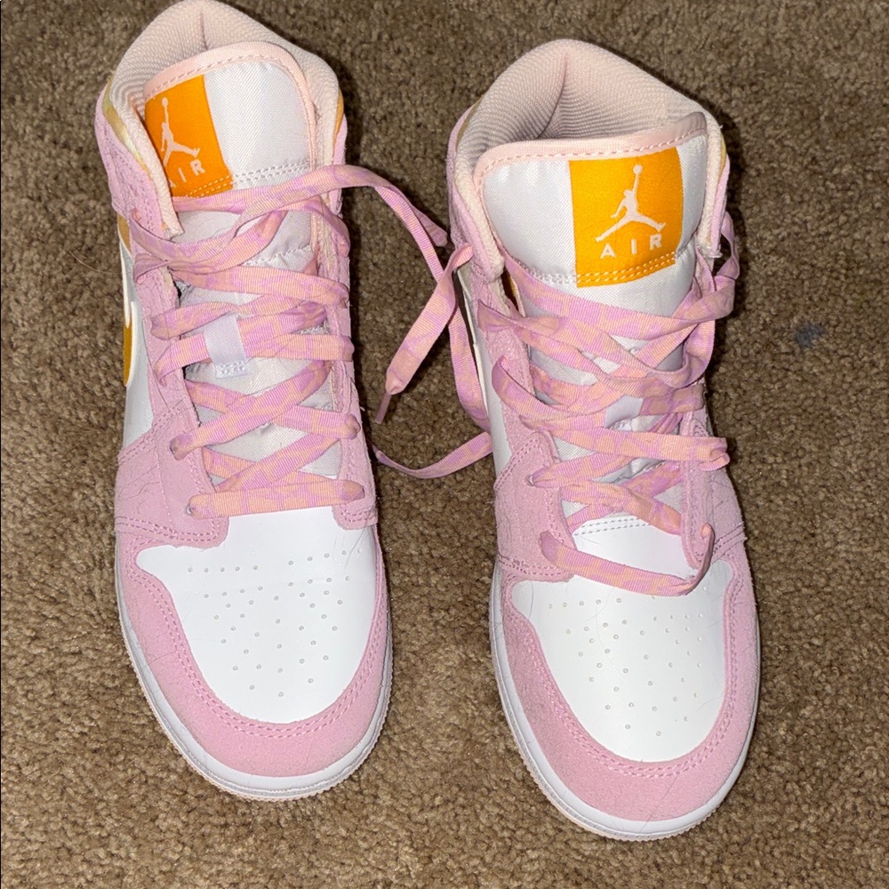 Nike Pink and White Air Jordan High-Tops with Orange Logo